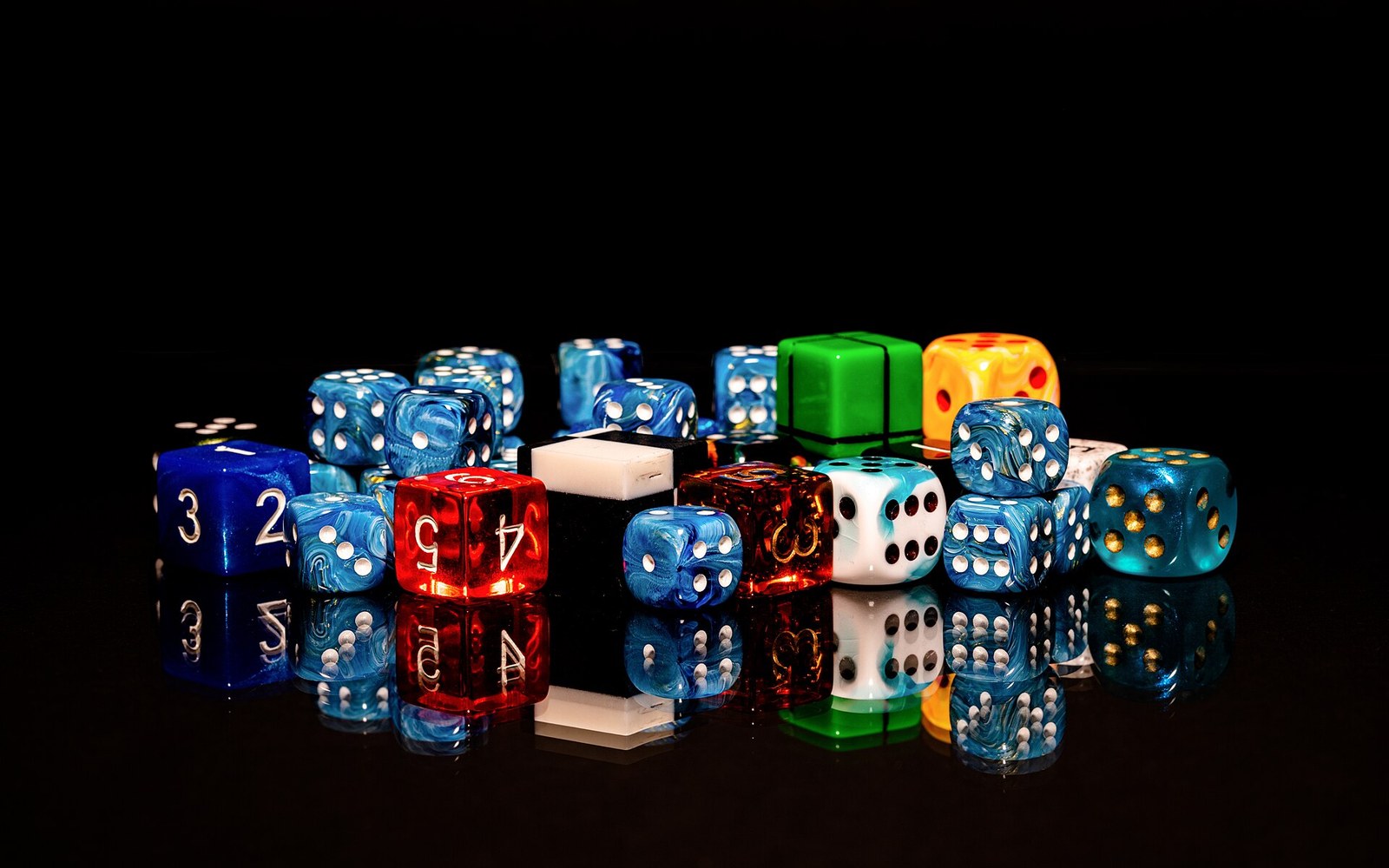 Colorful dice cluster with reflective surface showing pips and numbers in various hues